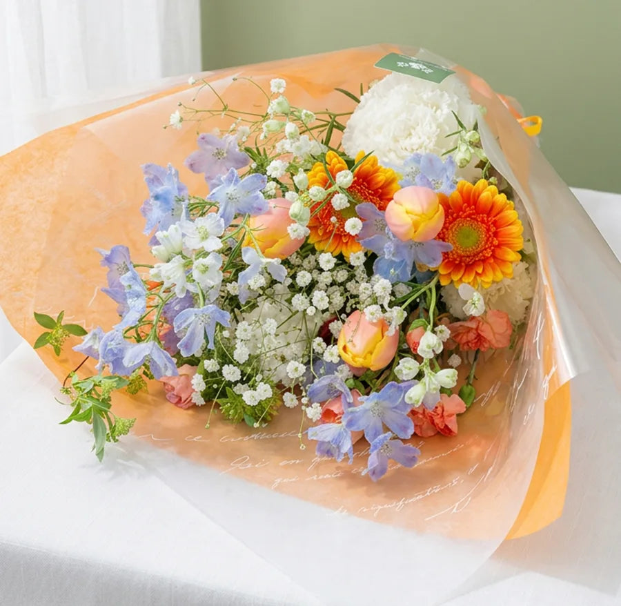 オレンジを中心とする花束・Mサイズ